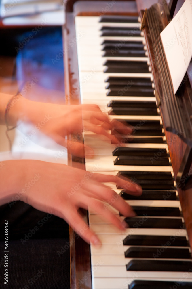 A lot of movement captured of hands playing piano.