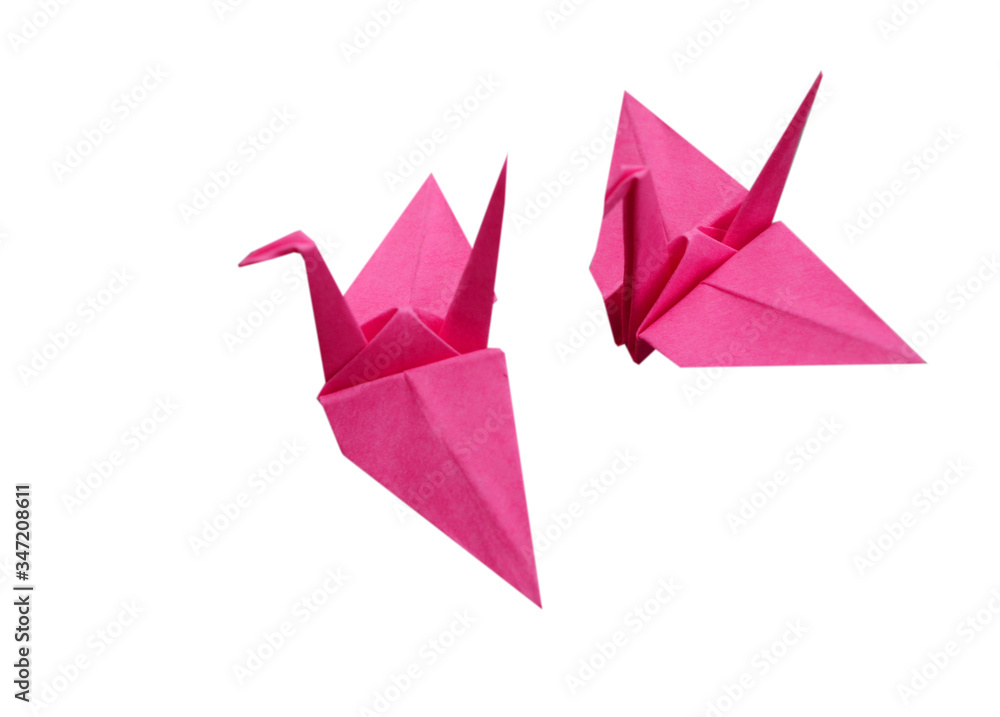 two pink origami birds on white two pink origami birds on white