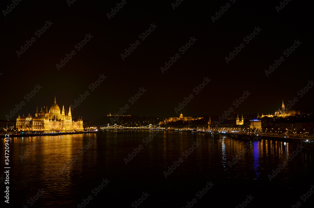 Night time at Hungarian Parliament Building. It is the seat of the National Assembly of Hungary, a notable landmark of Hungary, and a popular tourist destination in Budapest.