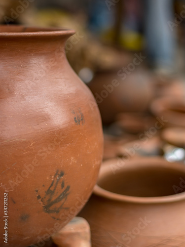 hand made with clay, pots are used to store drinking water and cook food on firewood in Africa