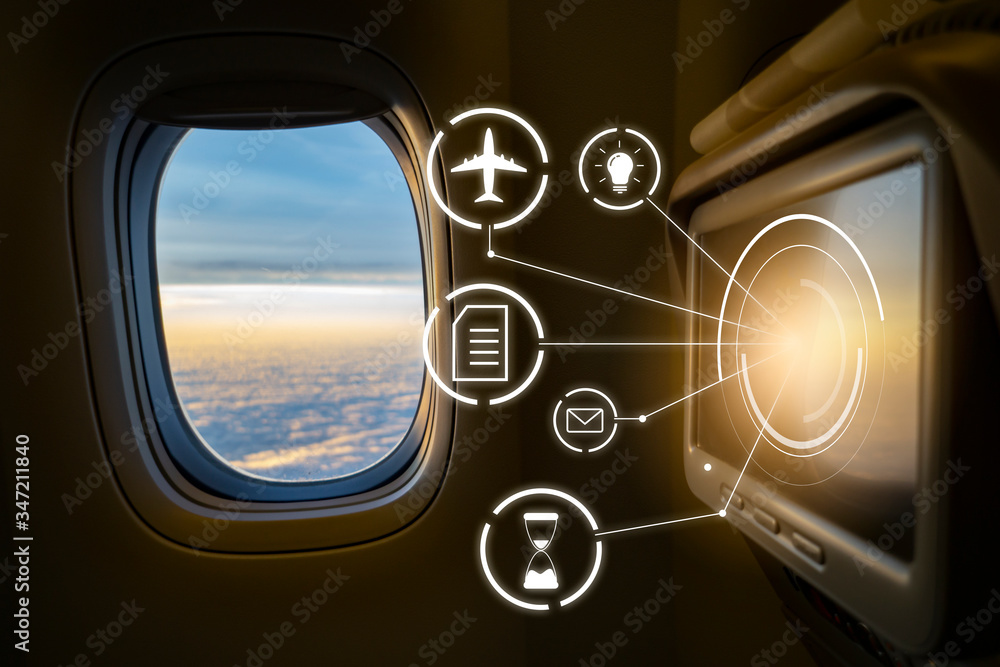 monitor screen on plane for customer entertainment and business pleasure, servicing technology live viewing information on airplane, looking out plane window with beautiful sunset cloud sky