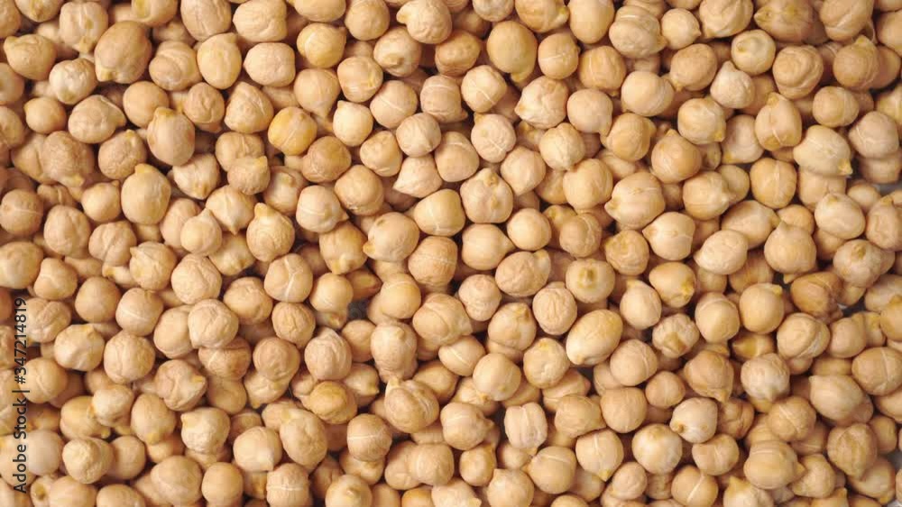 Abstract background from a pile of Turkish peas. . Slow rotation. Healthy eating concept Abstract background from a pile of Turkish peas. . Slow rotation. Healthy eating concept