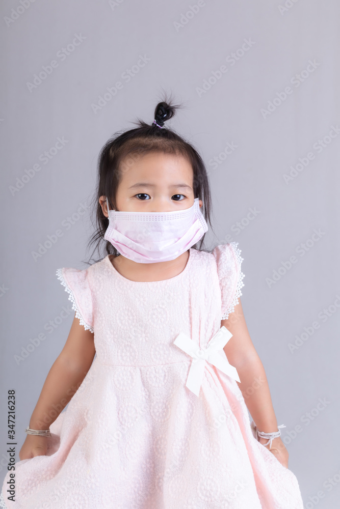 Little girl wearing mask for protect
