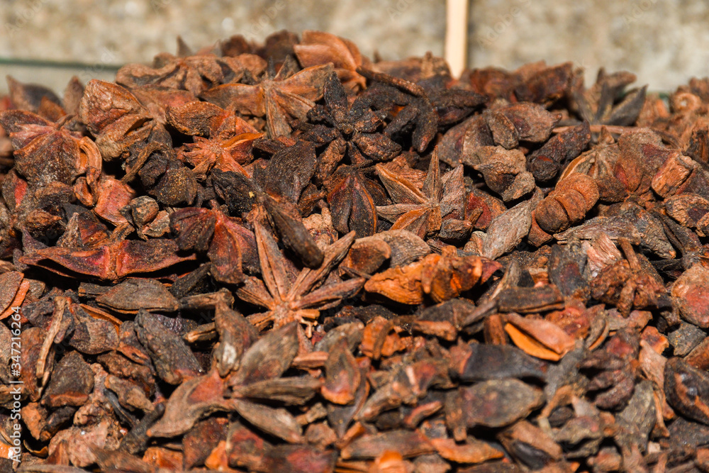 Macro shot of Badyan star anise spice at the market in India Macro shot of Badyan star anise spice at the market in India