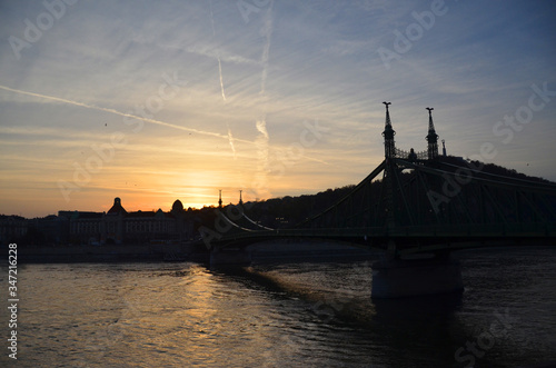 View of the Liberty bridge at Budapest, Hungary during sunset time. © peacefoo