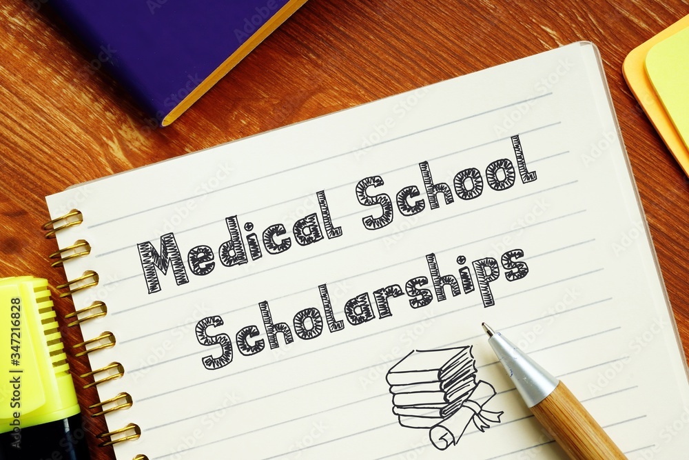 Medical School Scholarships sign on the piece of paper. Medical School Scholarships sign on the piece of paper.