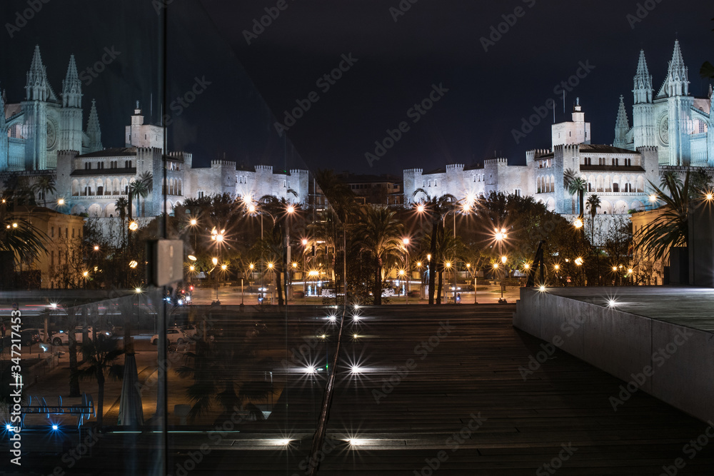 Palma de Mallorca, Spain, February 7, 2019: Palma Cathedral in the night lighting reflected
