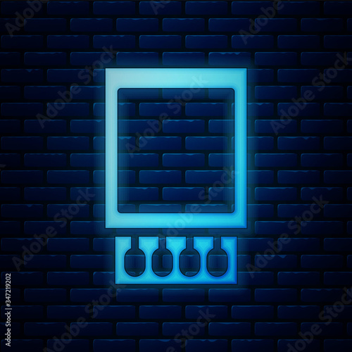 Glowing neon Open matchbox and matches icon isolated on brick wall background.  Vector Illustration