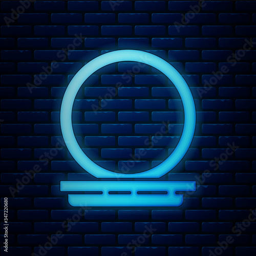 Glowing neon Makeup powder with mirror icon isolated on brick wall background. 8 March. International Happy Women Day.  Vector Illustration