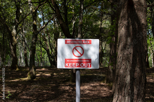 restricted area sign in woodland