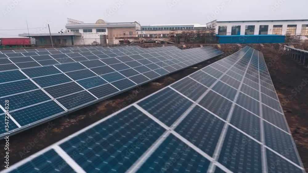 Modern sunny batteries on the field. Blue photovoltaic panels on a solar farm. Green alternative energy from the sun. Modern sunny batteries on the field. Blue photovoltaic panels on a solar farm. Green alternative energy from the sun.
