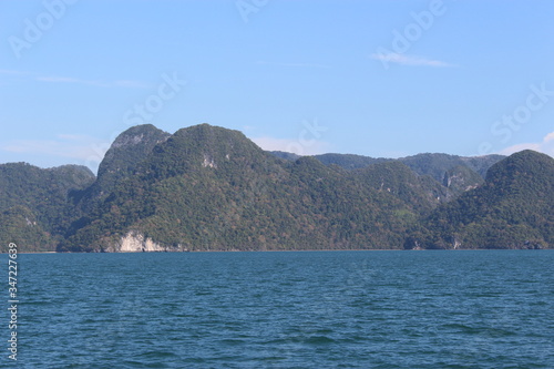 Lush green hilly islands inside the sea in Langkawi, Malaysia