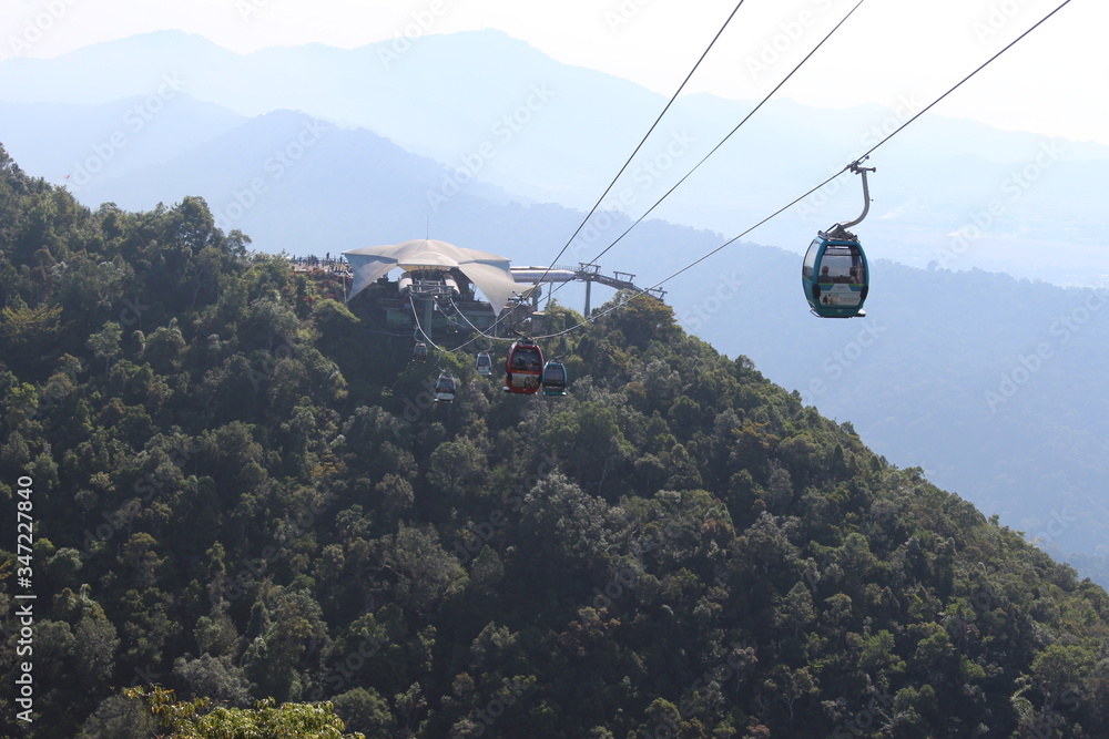 Fototapeta premium Cable cars in lush green mountains at Langkawi, Malaysia