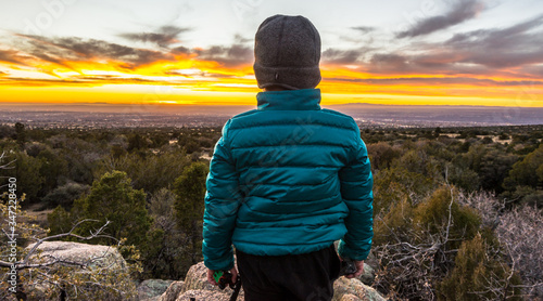 Child admiring a beautiful sunset