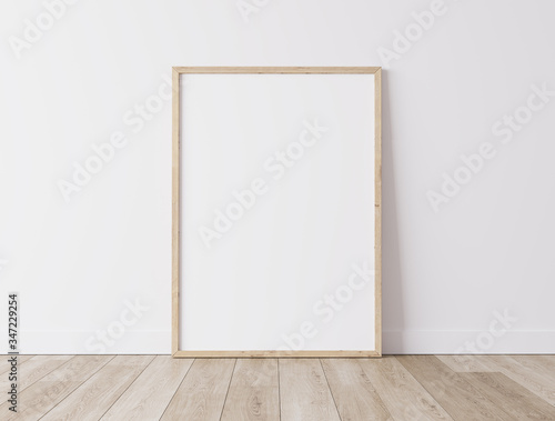 Fototapeta Naklejka Na Ścianę i Meble -  Realistic wooden Blank frame,size A3  A4 on White Wall and wooden floor. Design Template for Mock Up, 3D render, 3D illustration