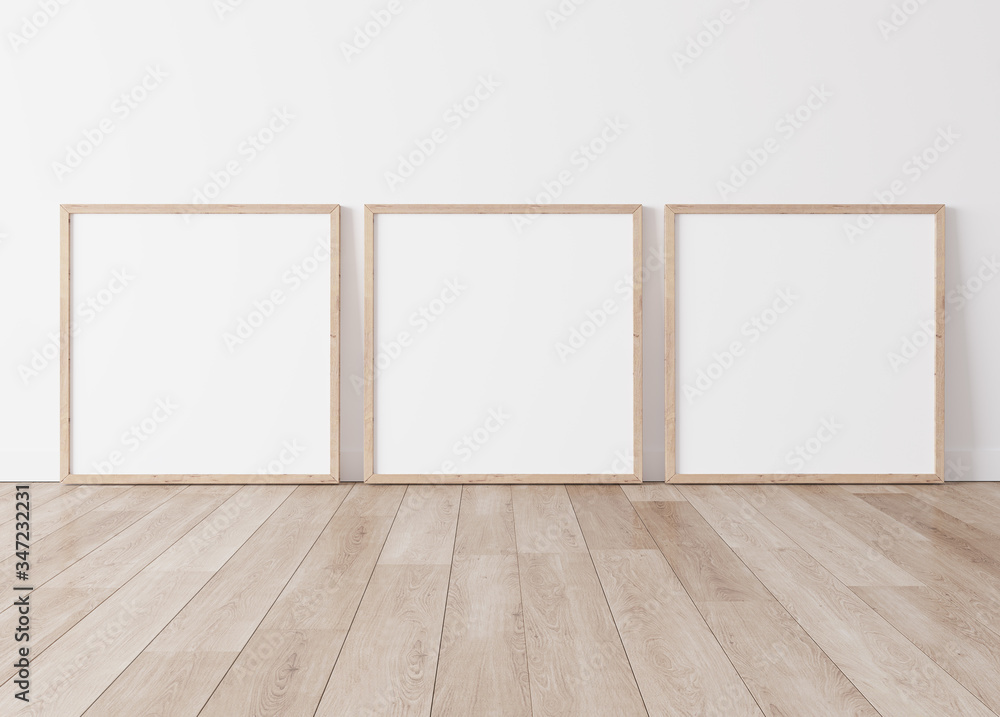 Three wooden square frames Standing on parquet floor with white background, minimal frame mock up interior Three wooden square frames Standing on parquet floor with white background, minimal frame mock up interior