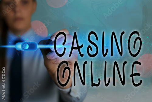 Writing note showing Casino Online. Business concept for Computer Poker Game Gamble Royal Bet Lotto High Stakes photo