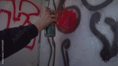 Urban Teen Drawing Graffitti On Wall