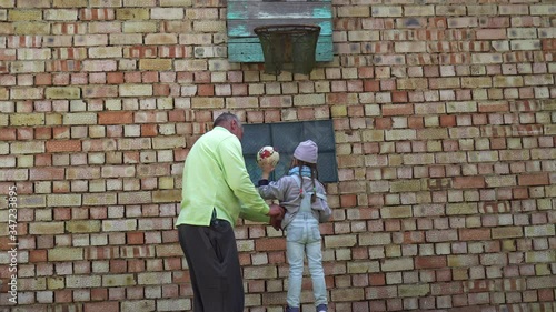 Wallpaper Mural Little girl playing with grandfather. Torontodigital.ca