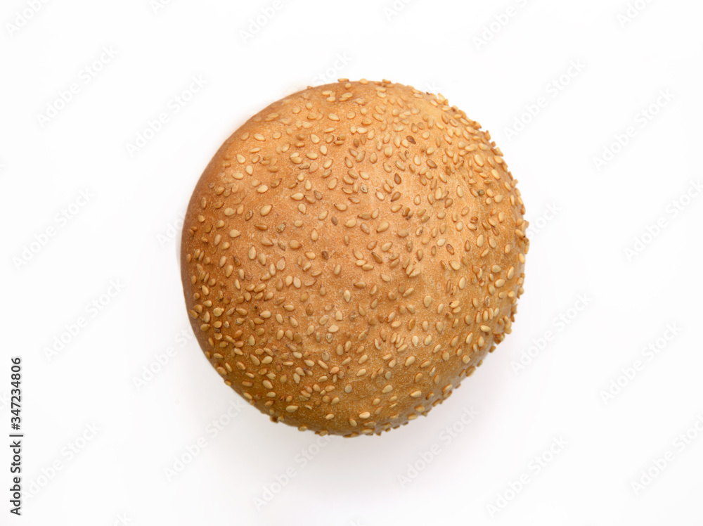 Fresh fragrant bun for burgers with sesame seeds on a white background. Can be used for advertising Fresh fragrant bun for burgers with sesame seeds on a white background. Can be used for advertising