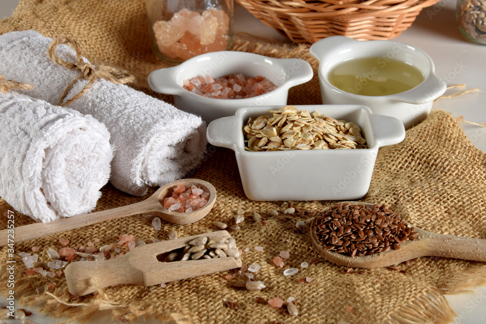 linseed, sunflower seeds and pink Himalayan salt on wooden spoons next to various ingredients for the production of homemade face and body cosmetics linseed, sunflower seeds and pink Himalayan salt on wooden spoons next to various ingredients for the production of homemade face and body cosmetics