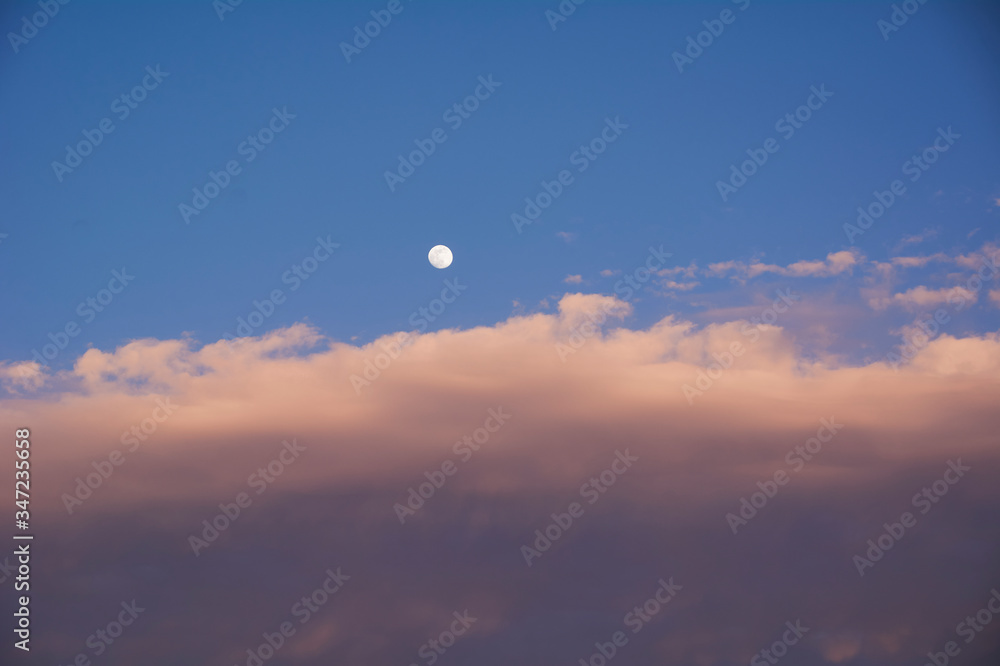 Full moon in blue sky with clouds Full moon in blue sky with clouds