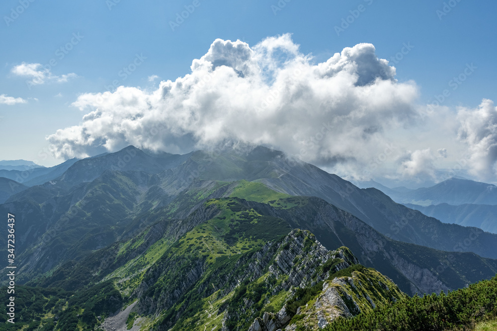 Rodica peak during summer in sunny and cloudy day, view from Sija peak, Julian Alpe, Slovenia