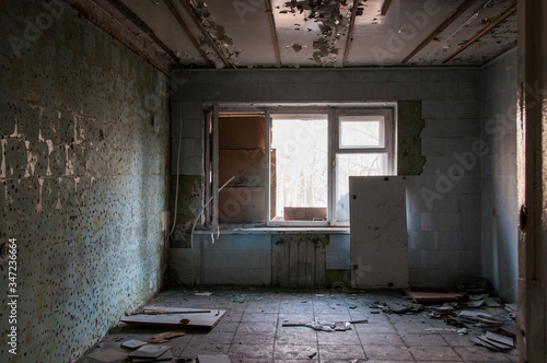 abandoned hotel building. abandoned room with cracked walls and peeling paint. broken windows, horror interior. 