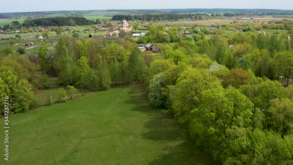 Aerial video flight over a Russian village on a Sunny spring day during the flowering of gardens Aerial video flight over a Russian village on a Sunny spring day during the flowering of gardens