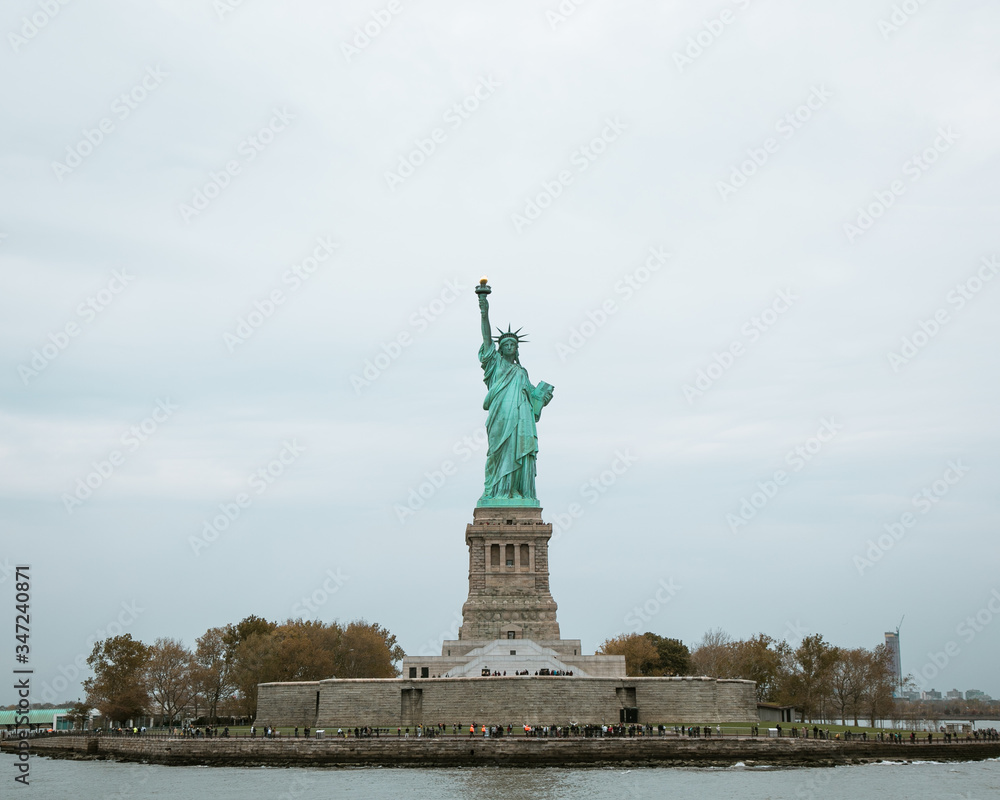 Statue of Liberty surrounded by tourists