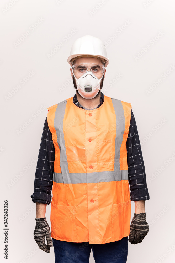 Male technician in orange workwear Male technician in orange workwear