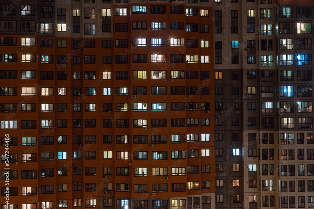 Butovo Park, Leninsky district of Moscow region, Russia-2020 . An area with numerous residential buildings. Suburbs. Suburban town in lights. Multicolored light in the Windows. Evening in the city. Butovo Park, Leninsky district of Moscow region, Russia-2020 . An area with numerous residential buildings. Suburbs. Suburban town in lights. Multicolored light in the Windows. Evening in the city.