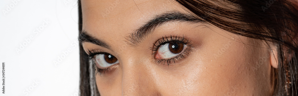 Obraz premium close up of young woman with brown eyes.