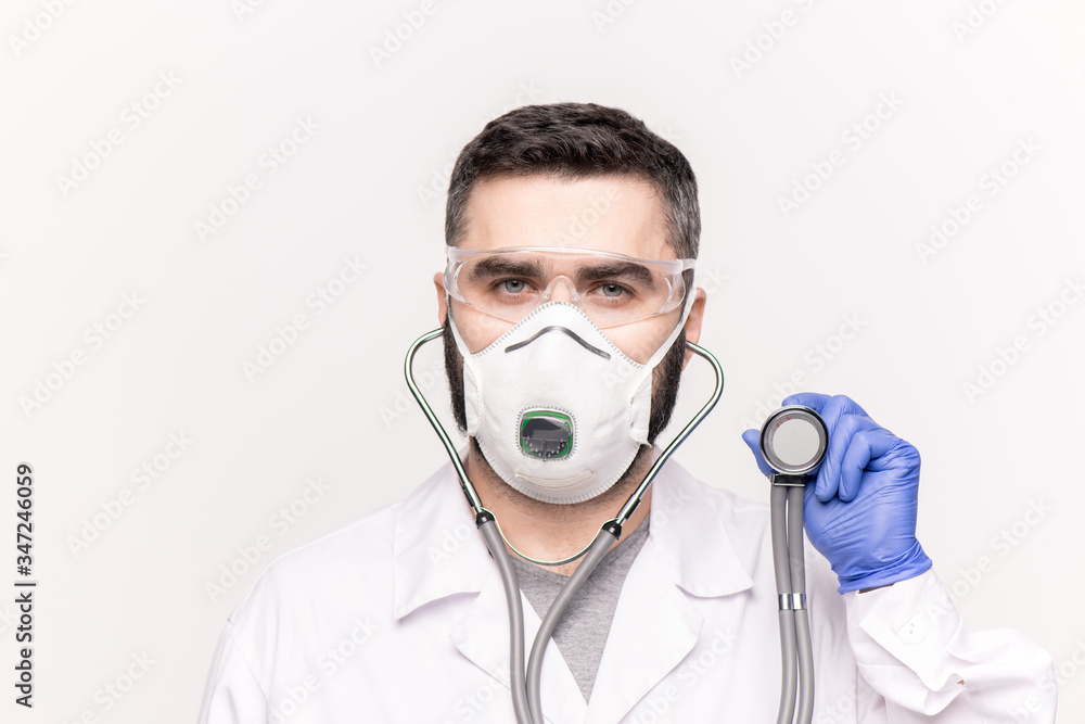 Head and shoulders of young clinician examining sick patient with stethoscope Head and shoulders of young clinician examining sick patient with stethoscope