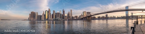 Fototapeta Naklejka Na Ścianę i Meble -  Large Panorama of Manhattan at Dawn witht the Brooklyn Bridge to the Right