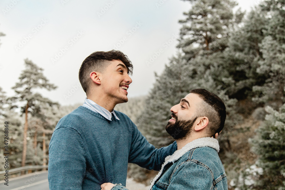 Fototapeta premium Gay couple in love on a mountain road