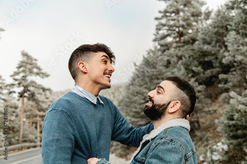 Gay couple in love on a mountain road
