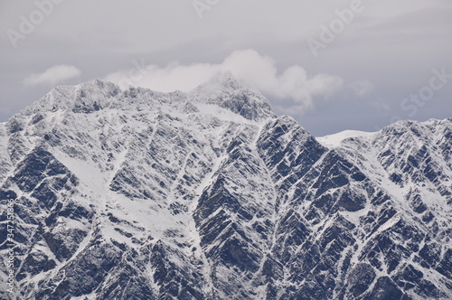 The jagged snow covered peaks of the Remarkables mountain range in Queenstown New Zealand