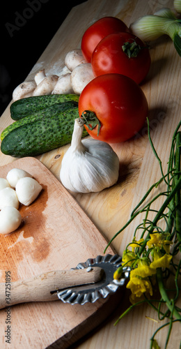 
Green cucumber and Vegetables for making pizza. Ready free space for text.