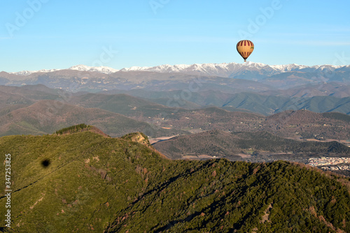 hot air balloon over the mountains