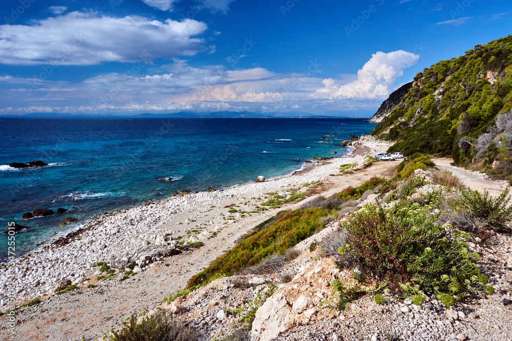 stone beach and Rocky cliff on the Greek island of Lefkada.