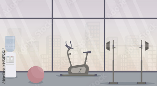 Gym without people during the virus epidemic against the backdrop of the urban landscape in the large windows.Training equipment: an exercise bike, a barbell, a water cooler and a fitness ball.Vector