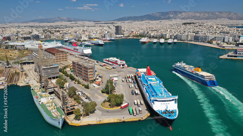 Aerial drone photo of passenger ferry reaching destination - busy port of Piraeus, Attica, Greece