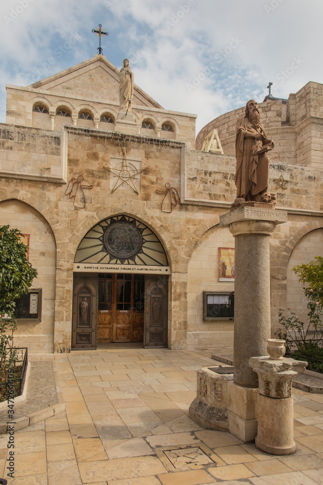 City of Bethlehem. The church Catherine next to the Basilica of the Nativity of Jesus Christ. Column with the figure of Saint Jerome