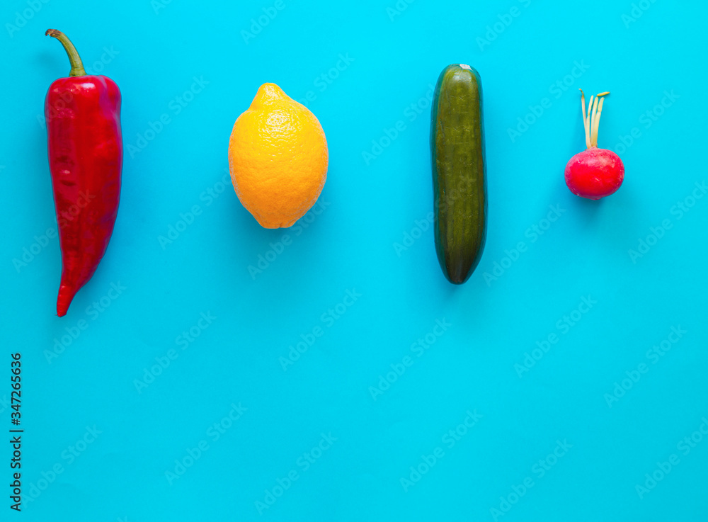 Flat lay top view of fresh vegetables over pastel blue backdrop with minimal style, copy space Flat lay top view of fresh vegetables over pastel blue backdrop with minimal style, copy space