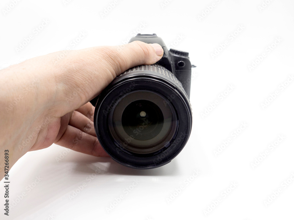 Photo camera in hand man isolated on white background