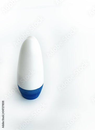 White antiperspirant with a blue cap on a white isolate