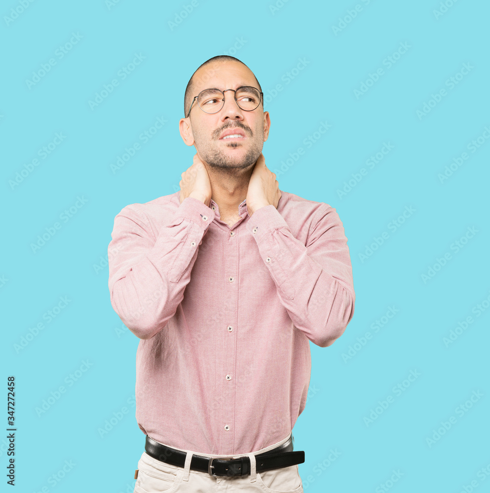 Concerned young man with a gesture of pain Concerned young man with a gesture of pain