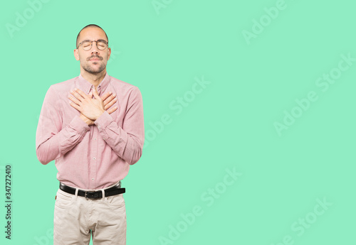 Concerned young man with a gesture of pain