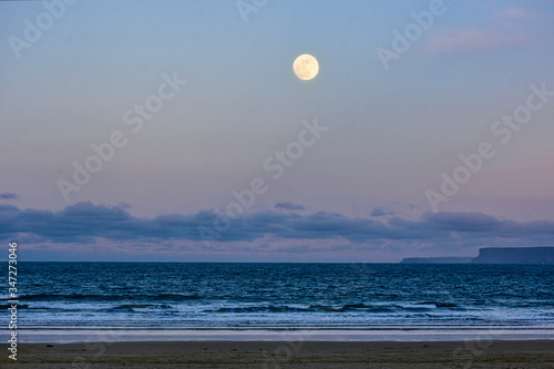 view of the moon over the beach
